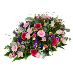 Roze / paars rouwarrangement